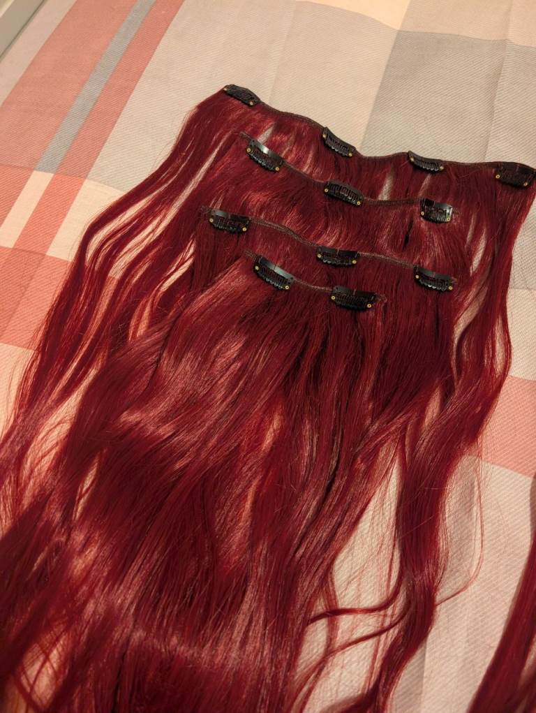 Red human hair extensions