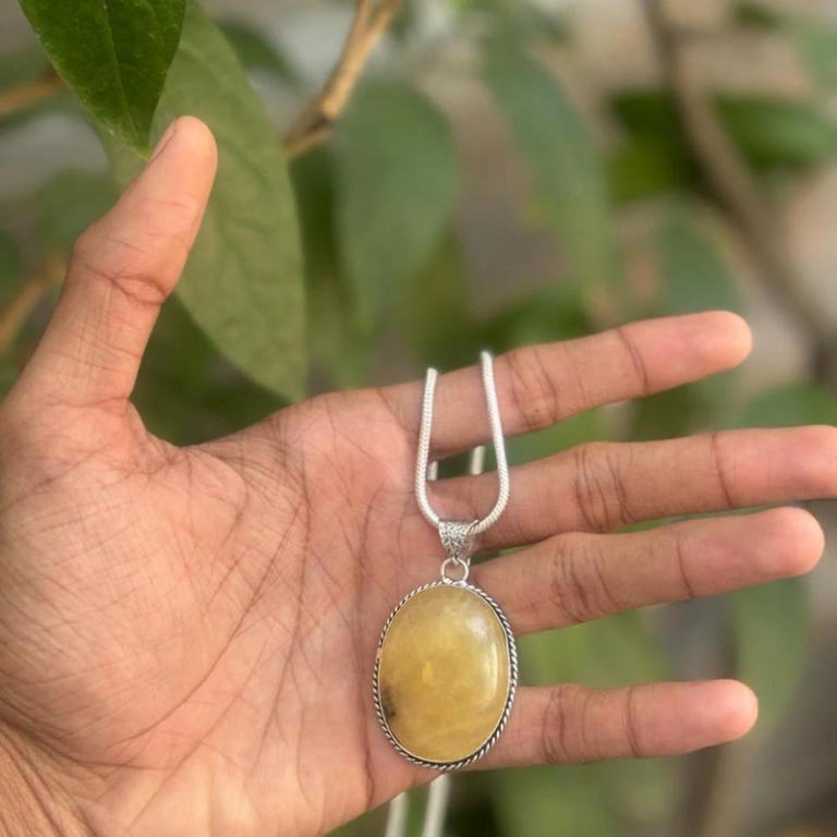 Natural yellow aventurine healing crystal pendant with chain. A bright and uplifting piece, perfect