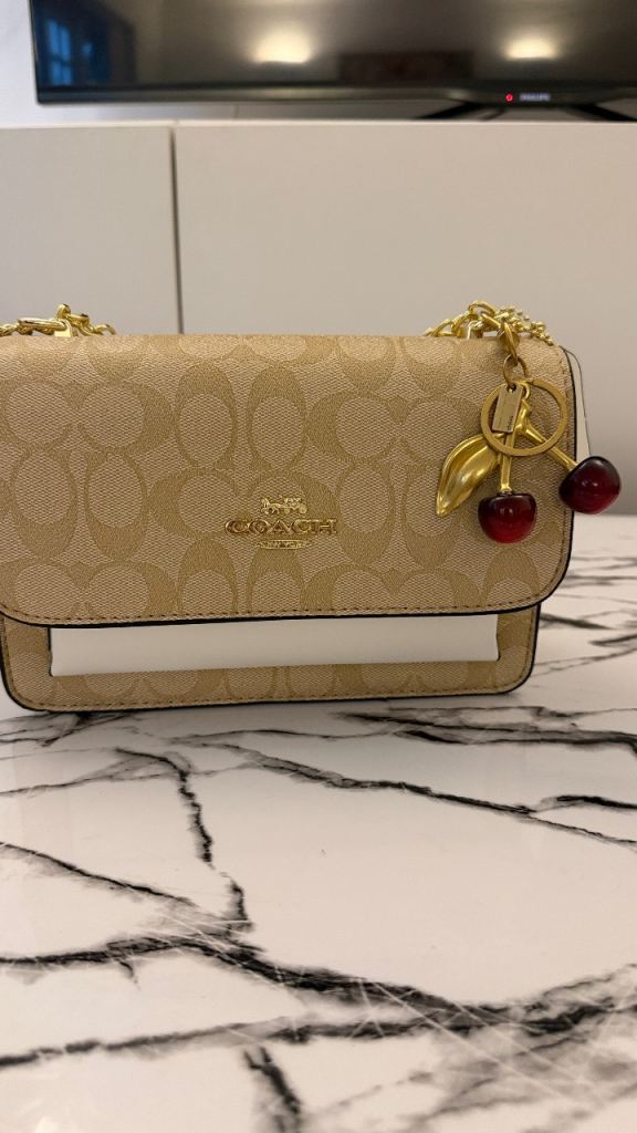 New Coach Crossbody Bag with Cherry Charm – Beige