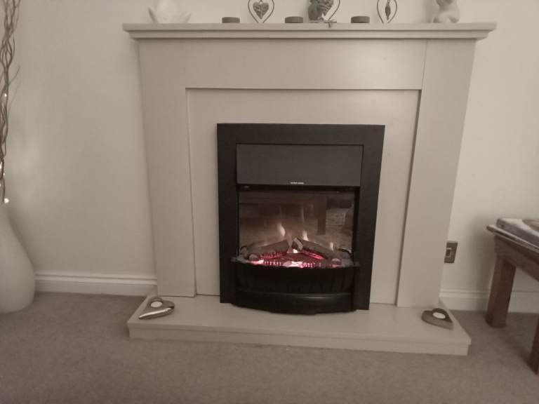 Inset electric fire with surround