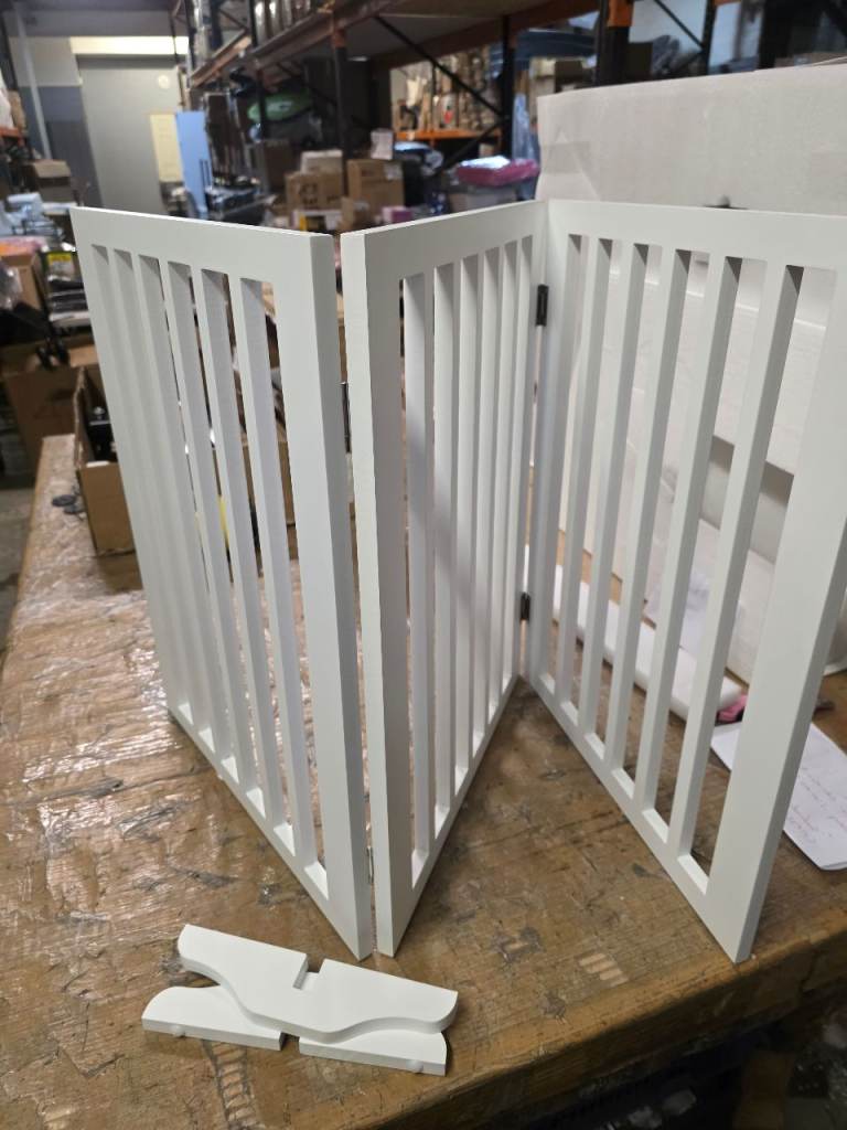 A new still boxed white wooden three panal freestanding pet gate with 2 feet 