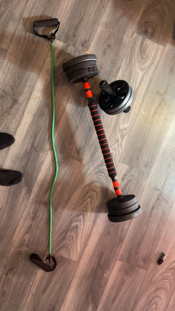 Free weights and ab roller and band 