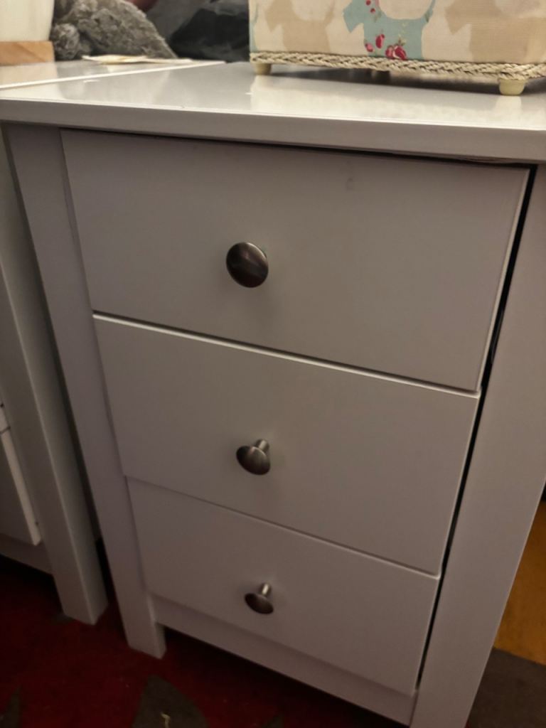 2 white bedside tables with 3 drawers