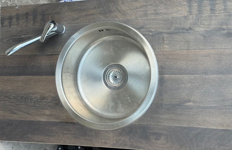 Stainless steel sink with tap 