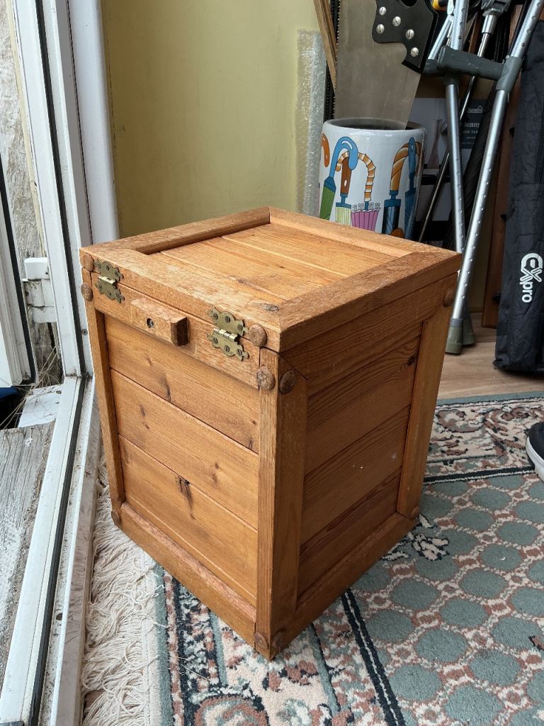 wooden pine box with hinged lid.