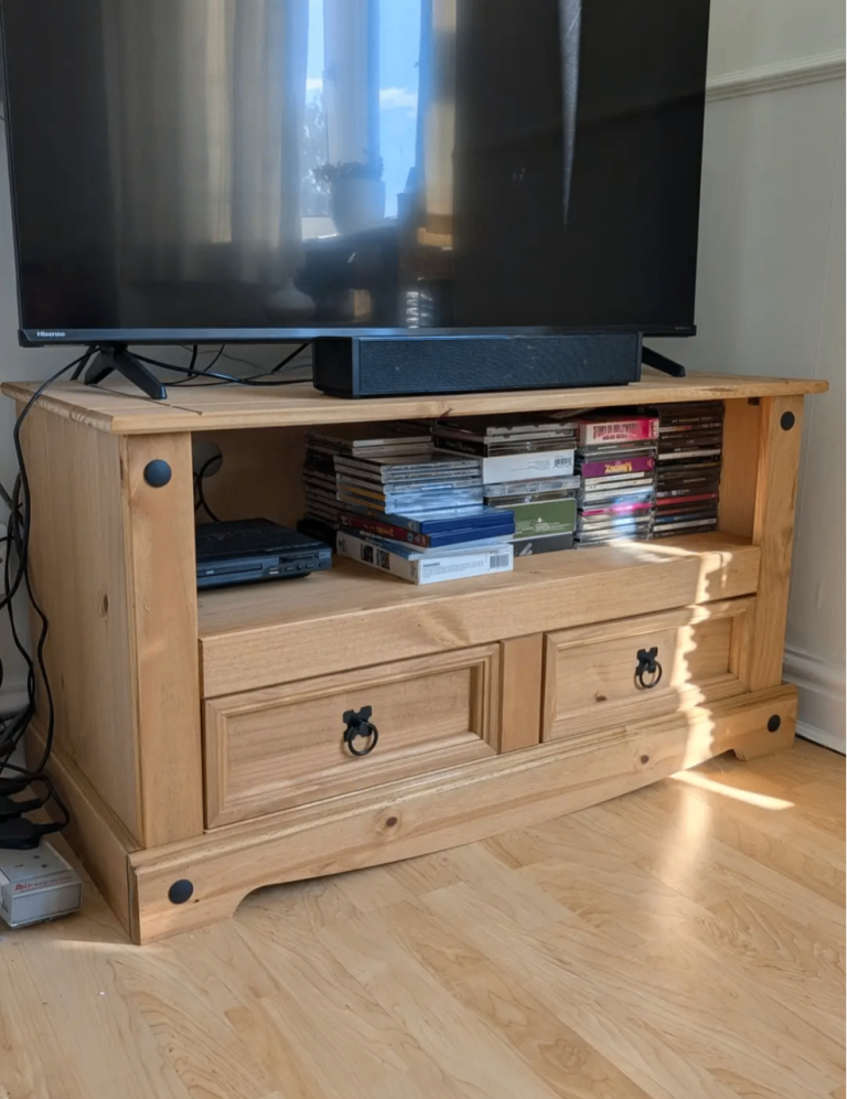 Solid pine tv cabinet with 2 drawers and a shelf space.