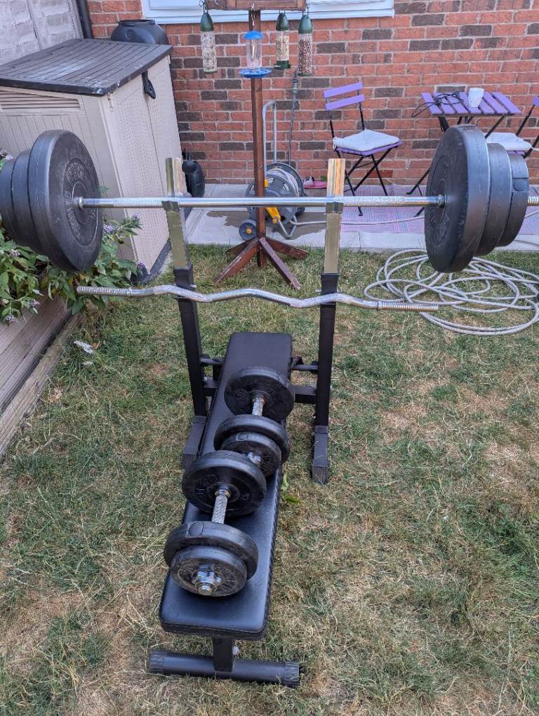 Weights bench with weights and dumbells