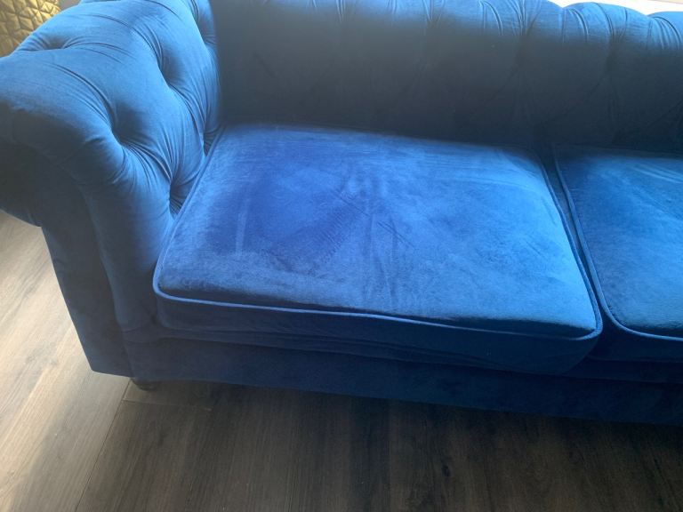 Blue velvet chesterfield sofas