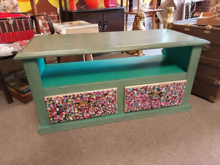 Tv Cabinet, Distressed finish. Green's in colour, jewelled drawer fronts.