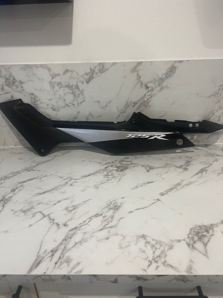 Honda CBR125R rear left seat side panel faring cowl