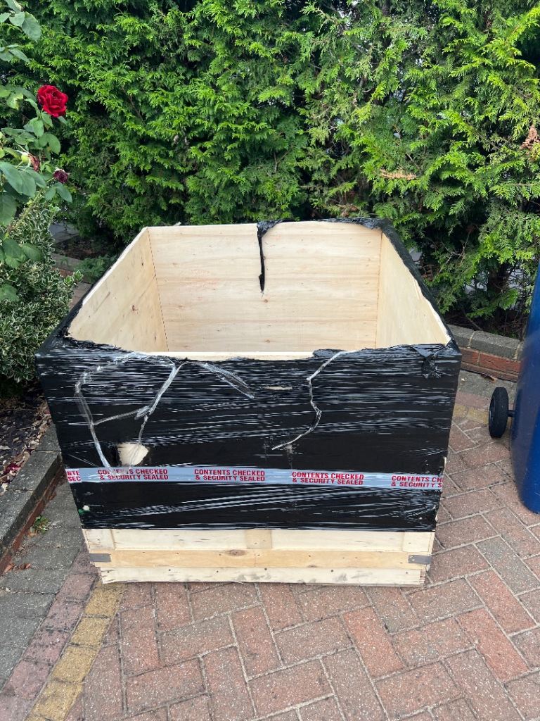 Large Wooden Shipping Crate and Blue Pallet