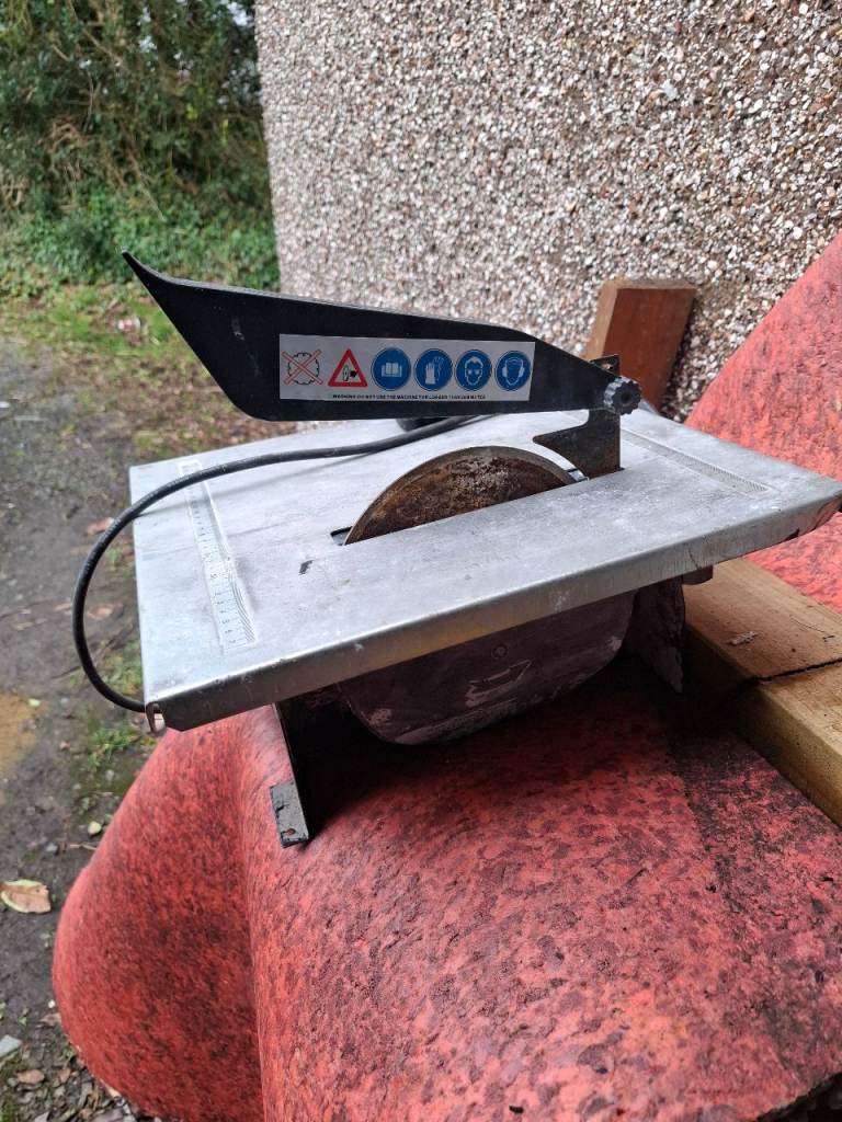 Electric tile cutter.