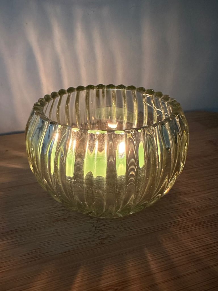 Vintage fluted green glass tea light holder or bowl.