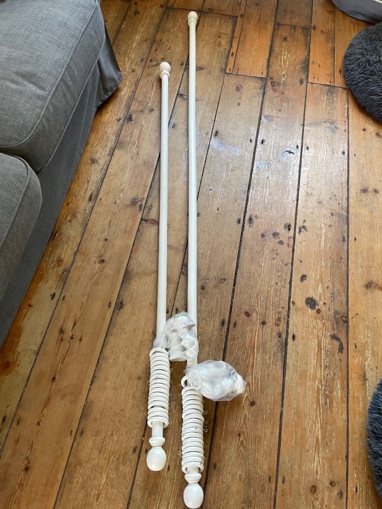 Free white wooden curtain poles good condition 