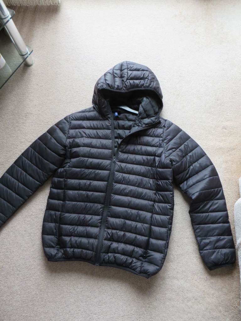As new black jacket with a hood  medium size lightweight no pets non smoking 