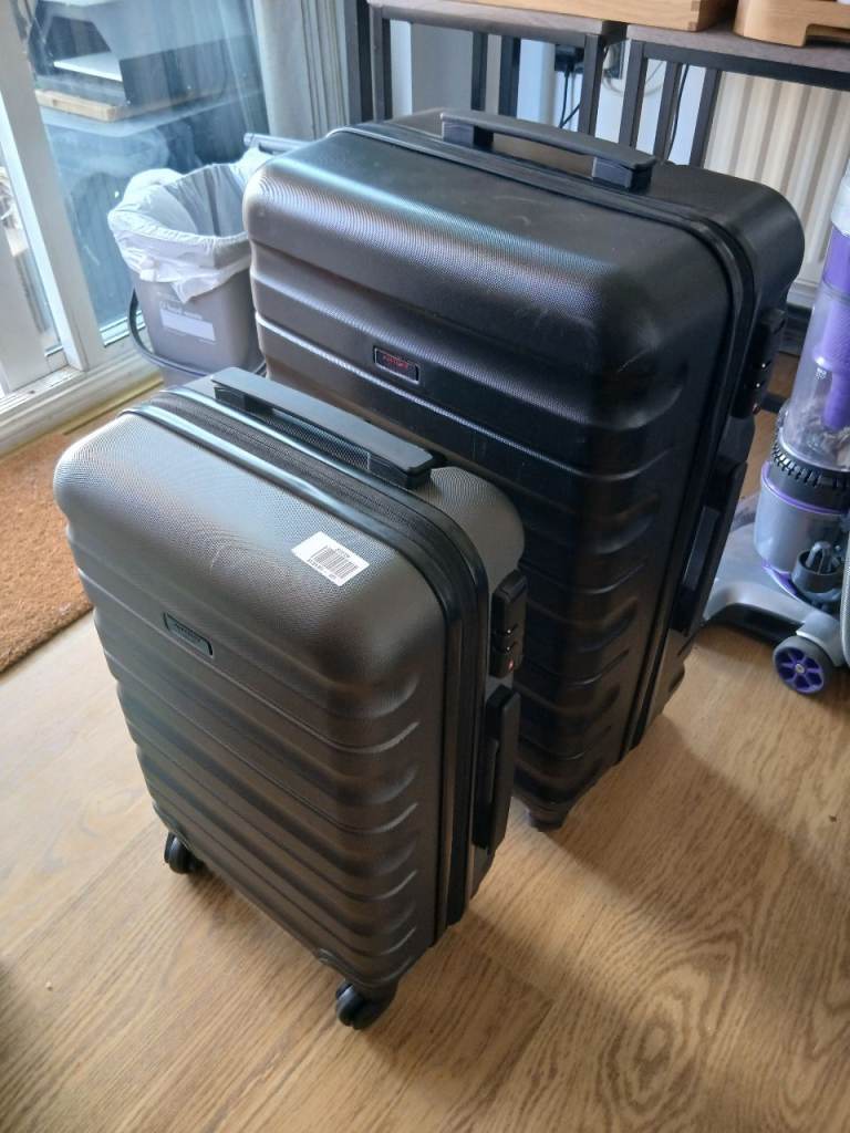 2 x John Lewis hard shell suitcases