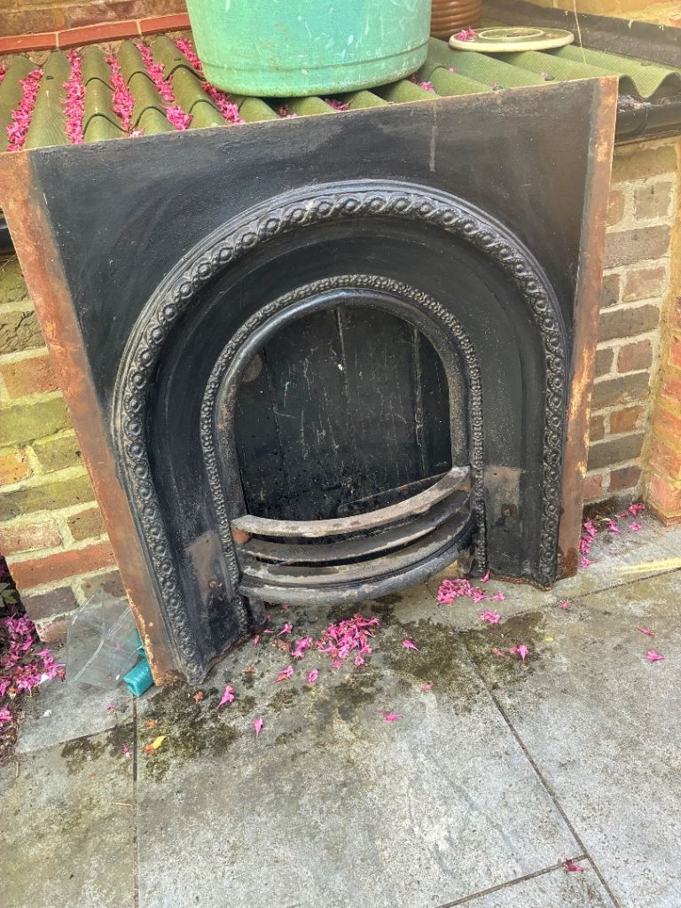 Antique Cast iron fireplace insert and front part.