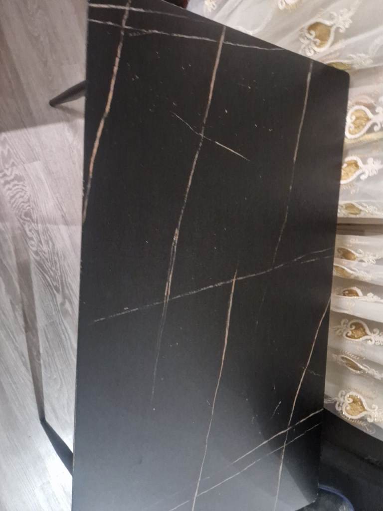 Lovely black dinning table in marble design