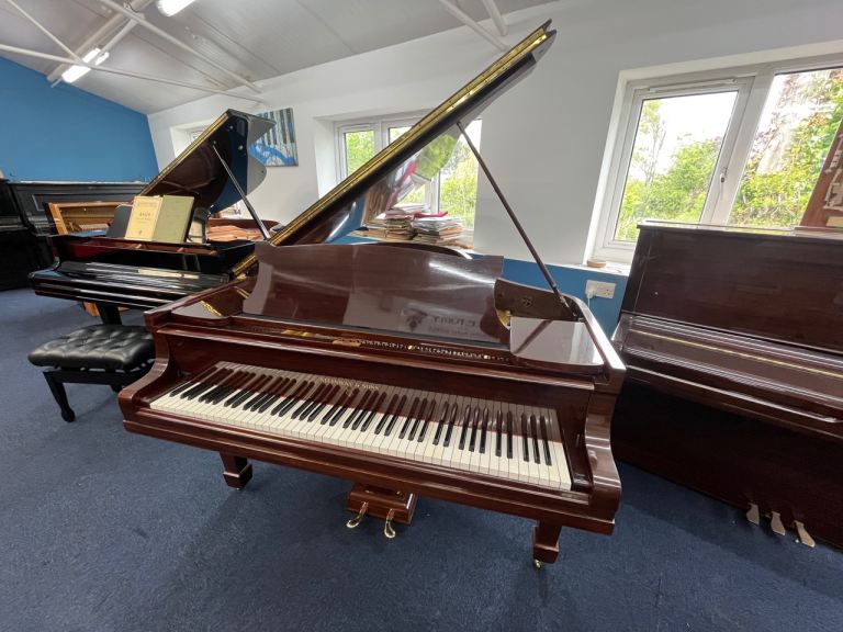 This is a stunning mahogany finish Model O Steinway & Sons baby Grand Piano