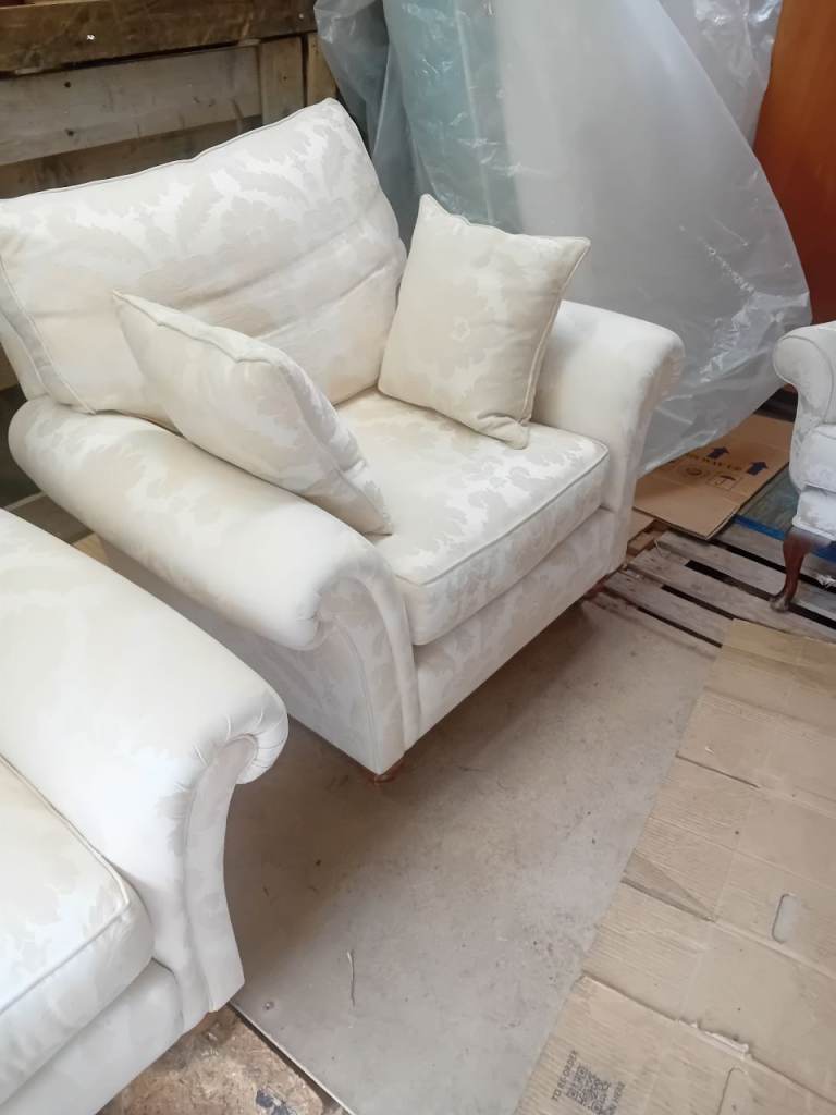 Two armchairs,one wing back chair.