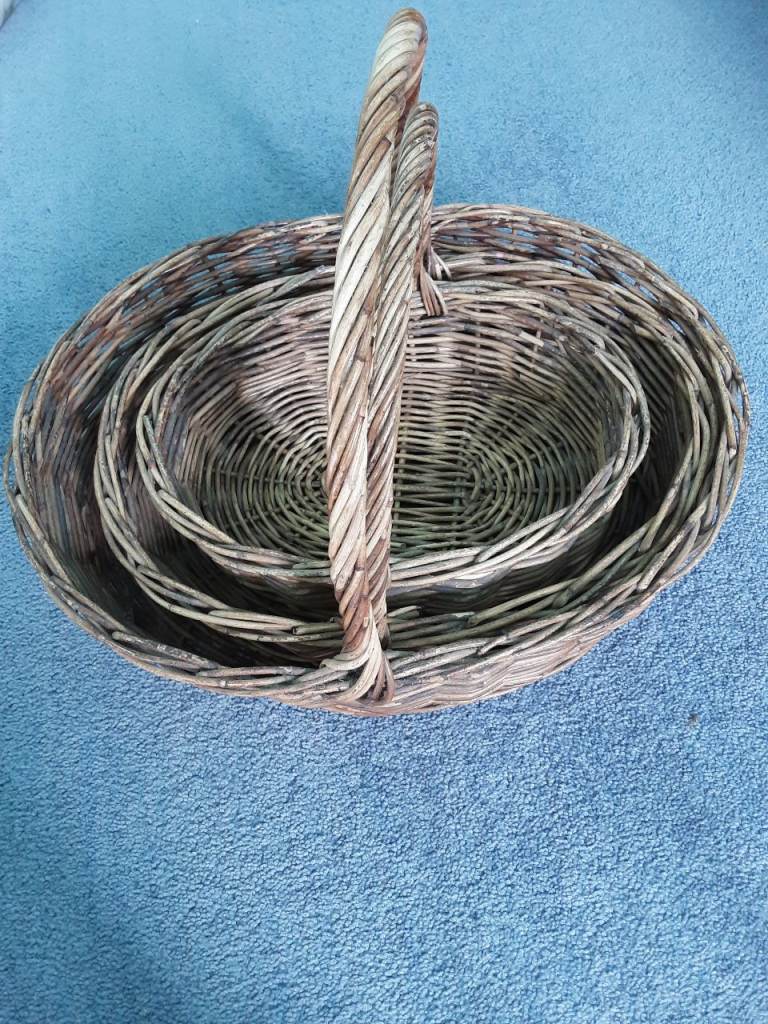 Three nested wicker baskets