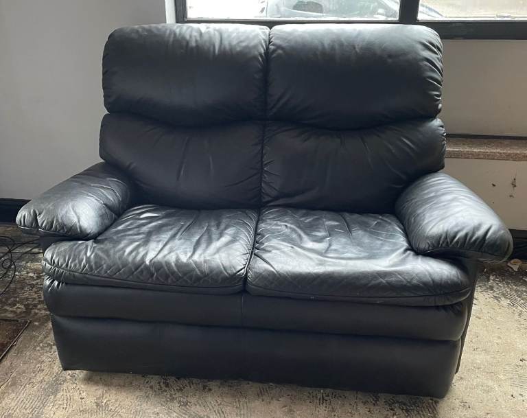 Black leather-effect two-seater sofa