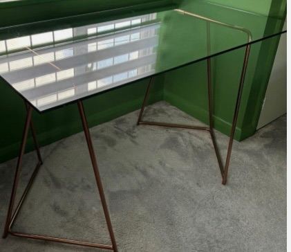 Made glass desk with brass legs. Immaculate