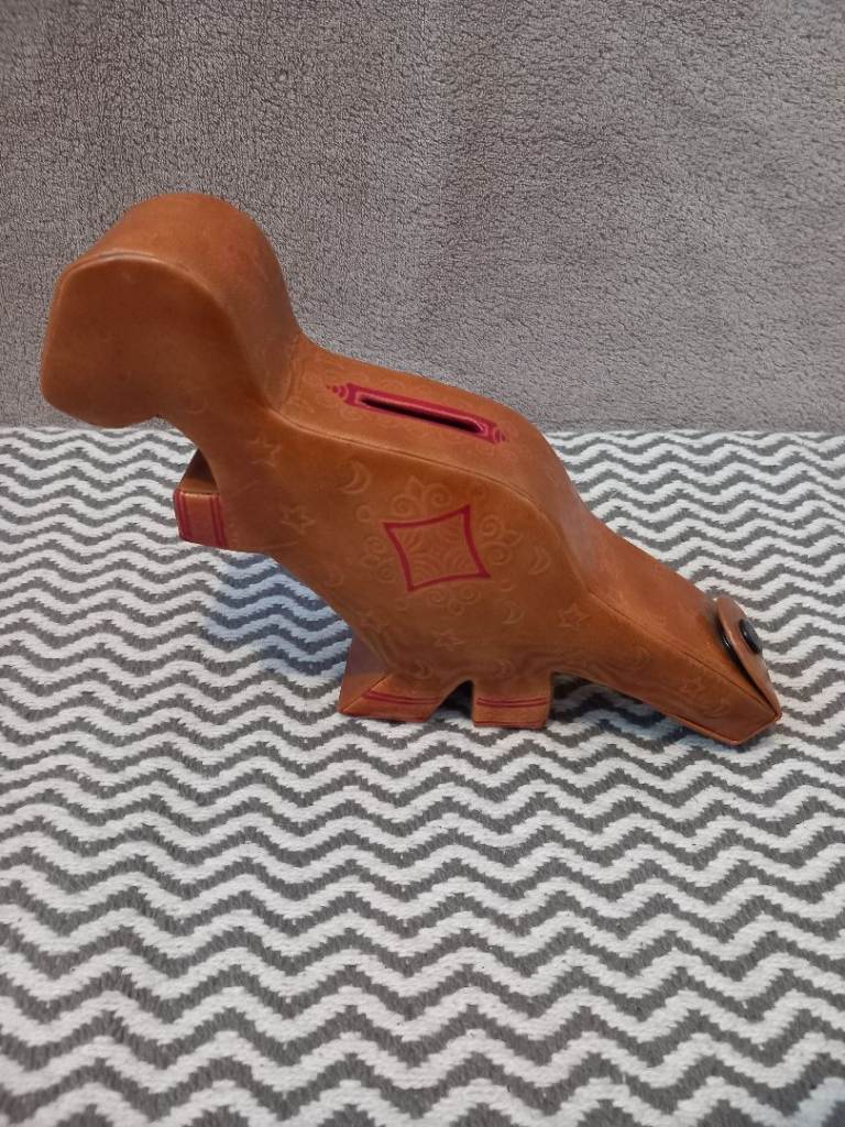 Dinosaur piggy bank
