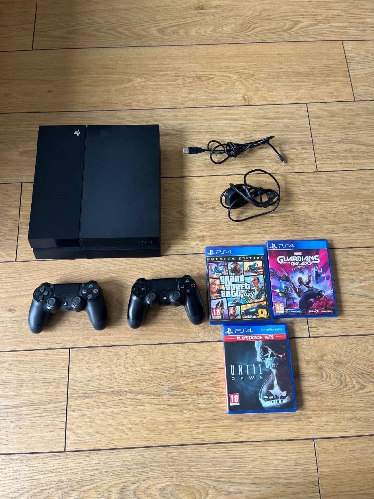 Sony PlayStation 4 500GB with 2 Controllers and 3 Games