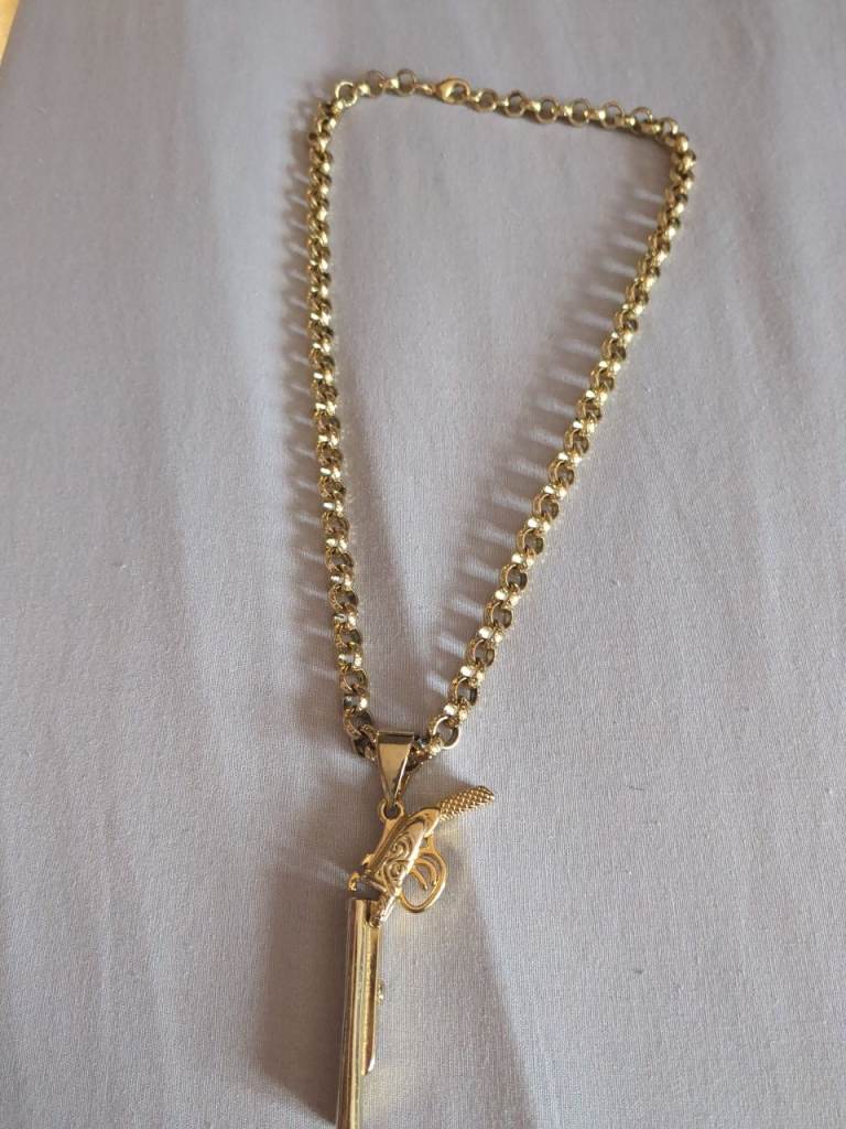 Gold plated chain with shot gun pendent and belcher with diamonds