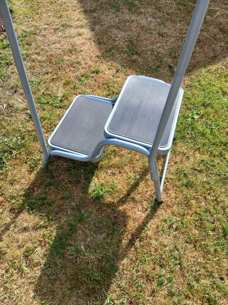 Caravan step with handrail