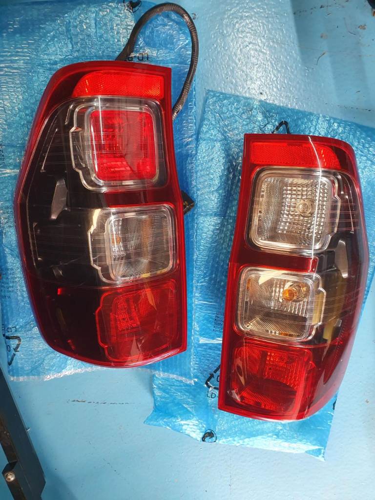 Ford Ranger T8 OEM rear lights. Perfect working order with factory wiring plug and play.