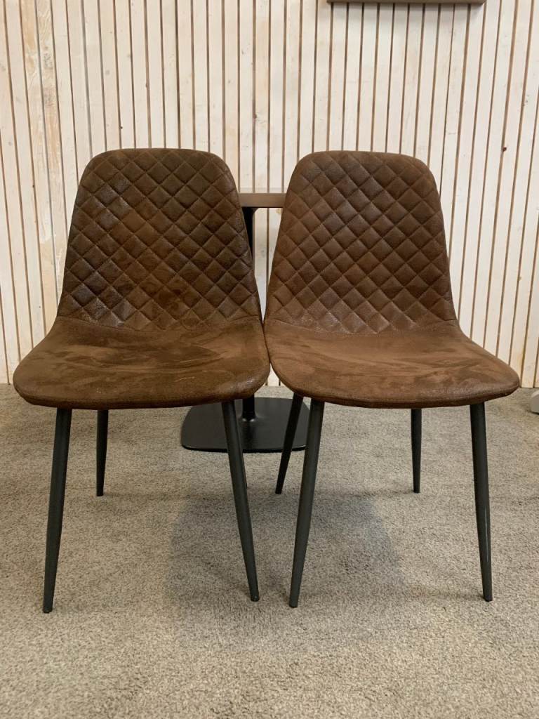 Bistro Dining Table with two Chairs, featuring Square Brown Faux-Suede Seats .