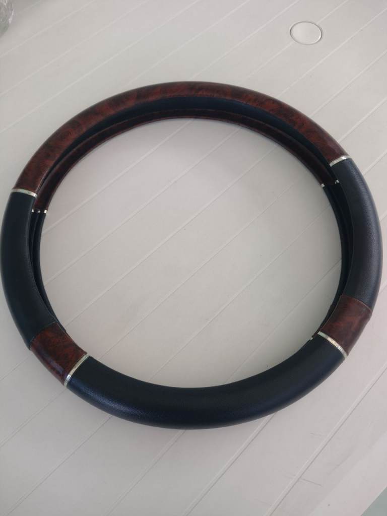 As New! Sturdy Vinyl Steering Wheel Cover. See the details below!