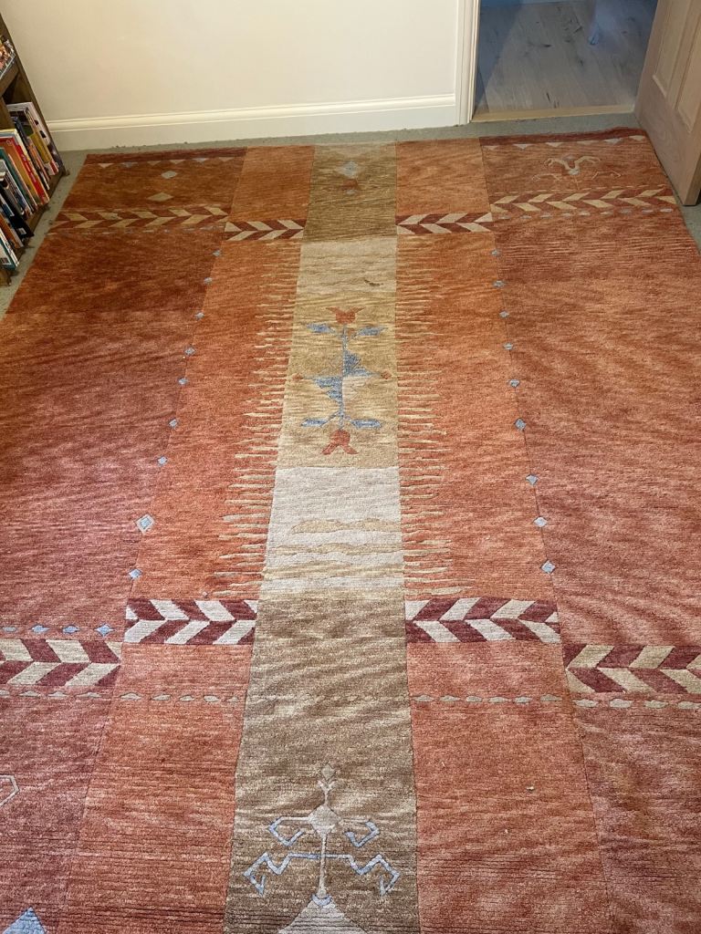 Lovely warm terracotta colours rug Large