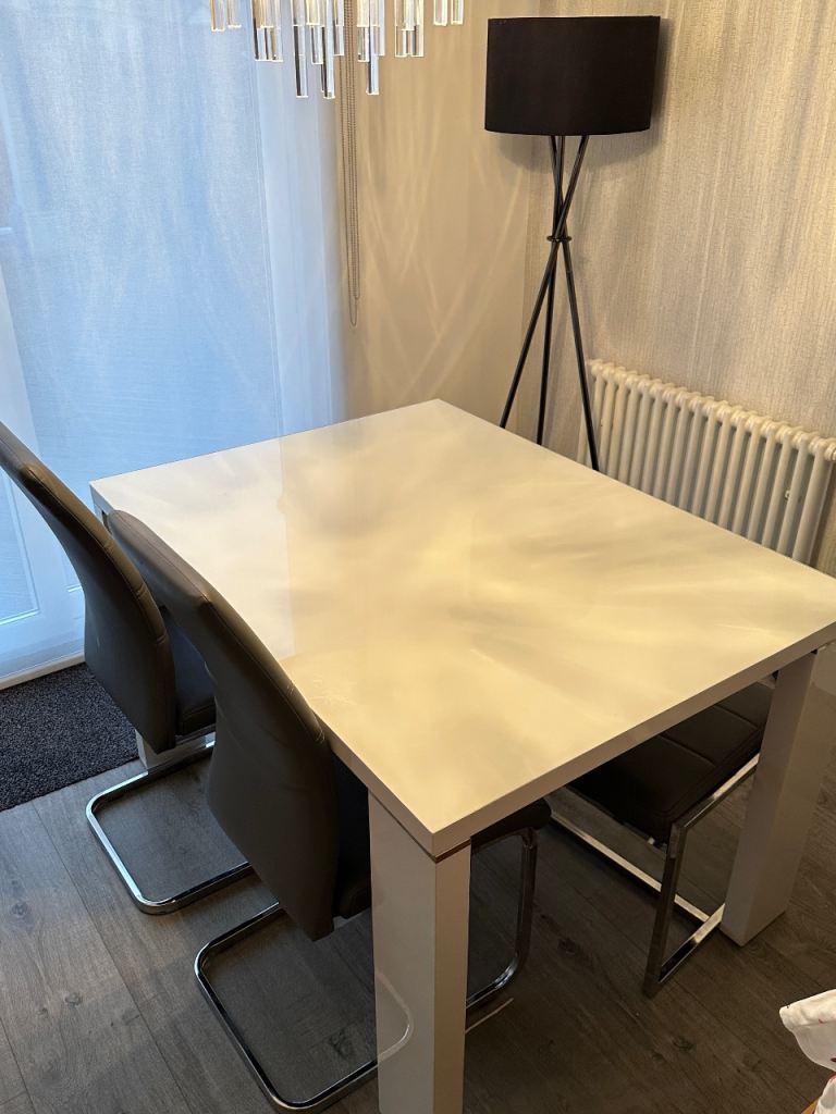 image for White glass top dinging table with two grey silver chairs - chrome legs 