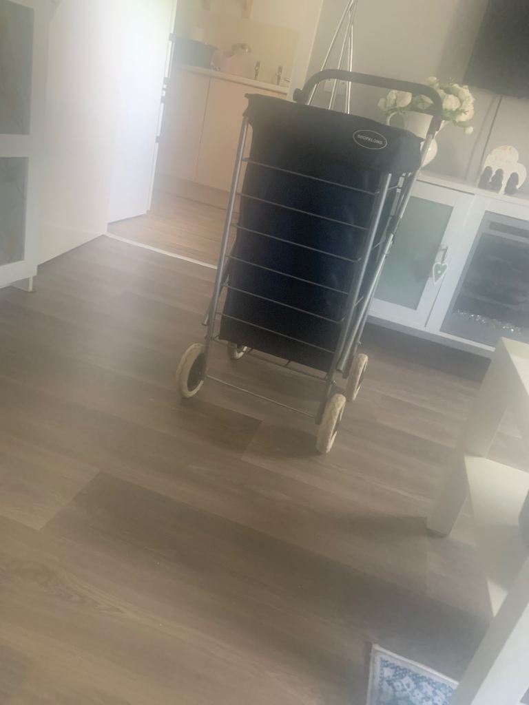 Hardly used navy shopping trolley