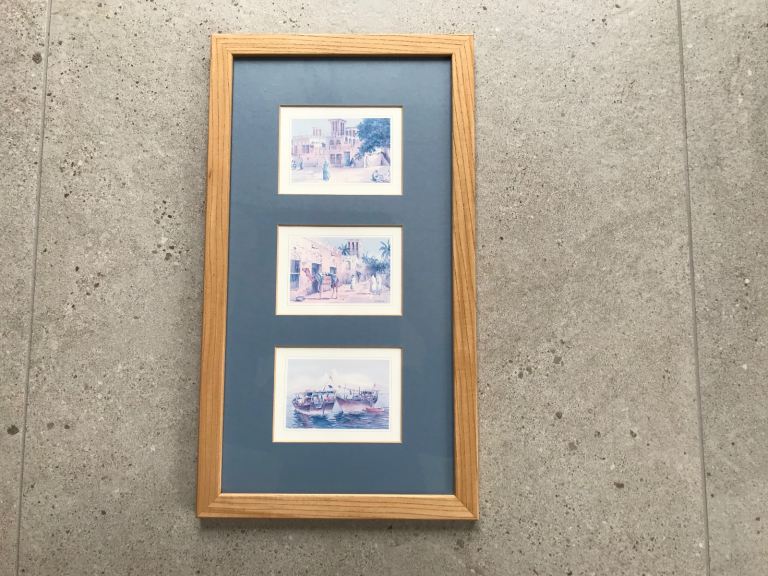 Dubai framed picture depicting three local scenes.
