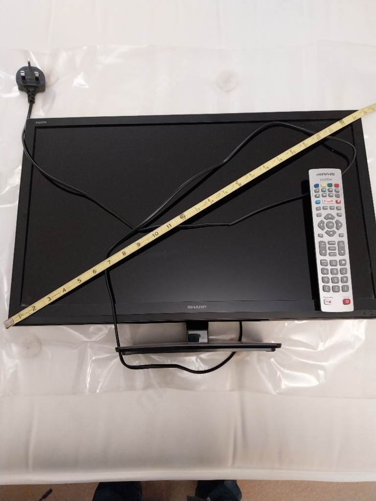 Black TV with Remote and Power Cable