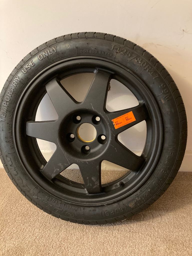 Spare wheel and tool set.