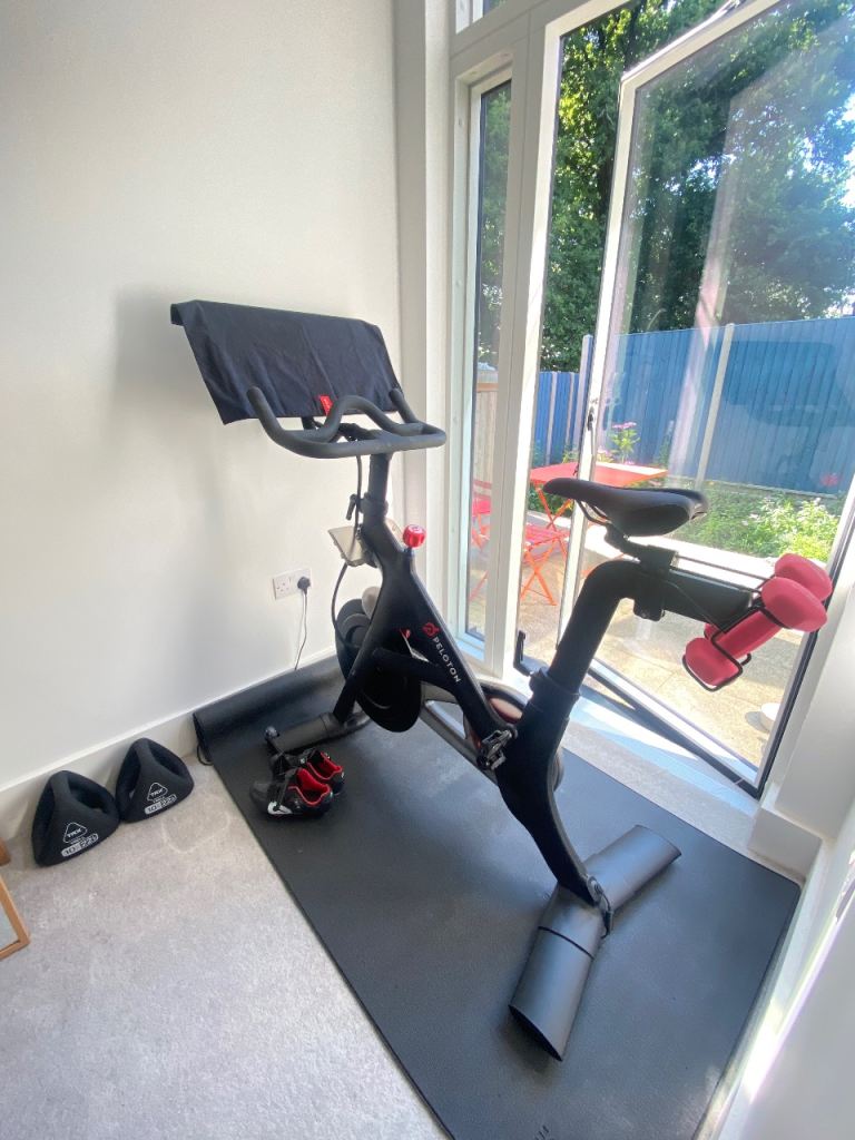 MUST SELL-Peloton Bike (2022) with Weights – Good Condition