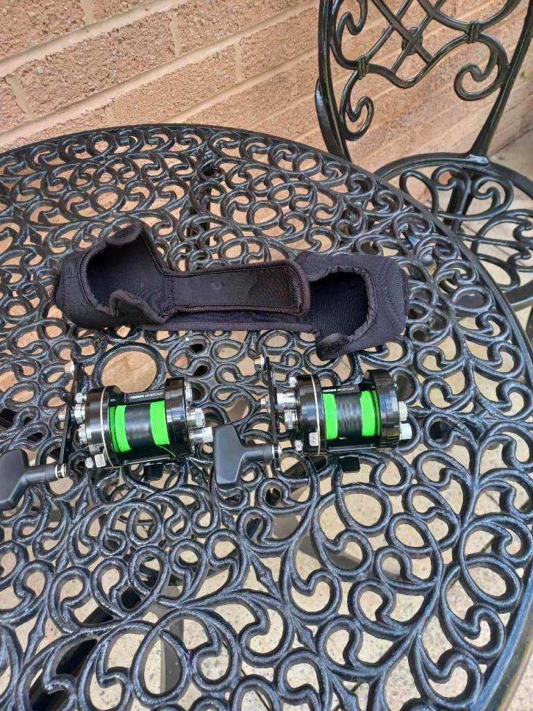 Pair of Fishing Reels with Neoprene Covers – Good Condition