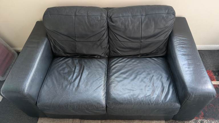 Black Leather Two-Seater Sofa – free for uplift 