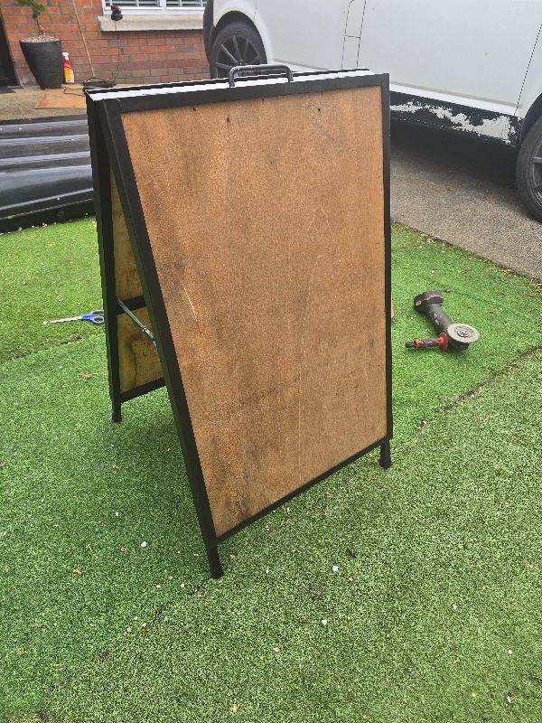 Double sided advertising board