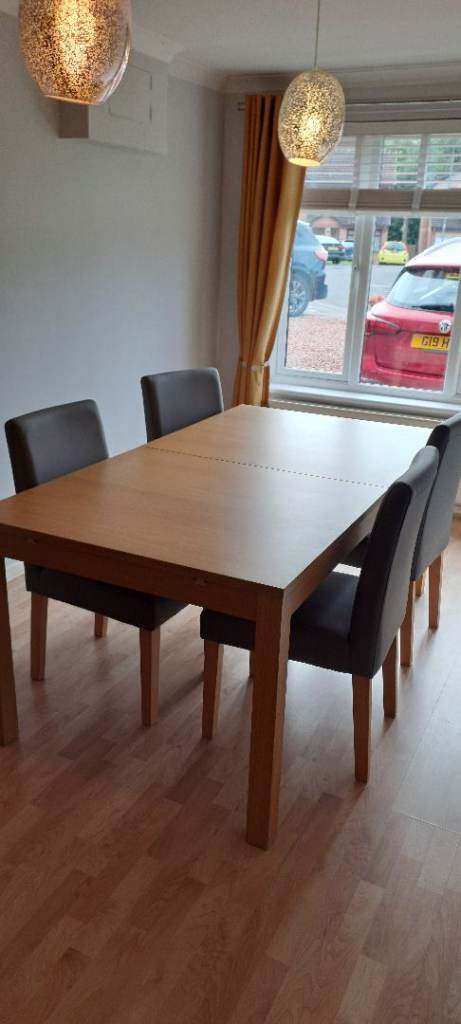 Wooden Extendable Dining Table with 8 Brown Chairs