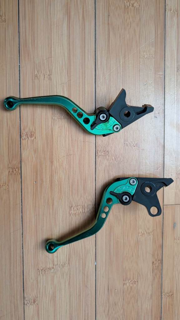 Metallic green motorbike racing levers