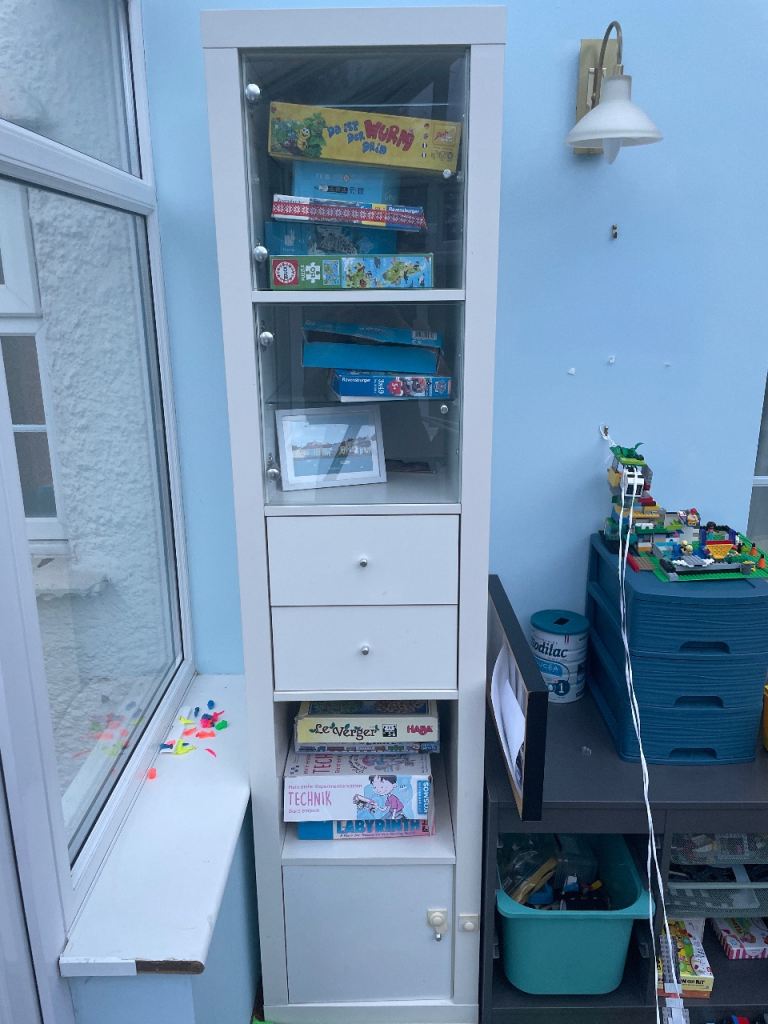 White Storage Unit with Glass Doors and Drawers