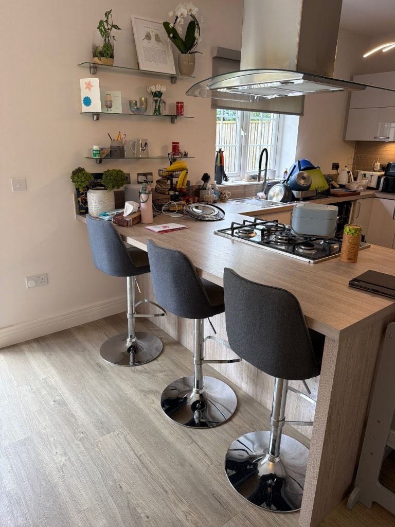 3 Grey pneumatic operated bar stools