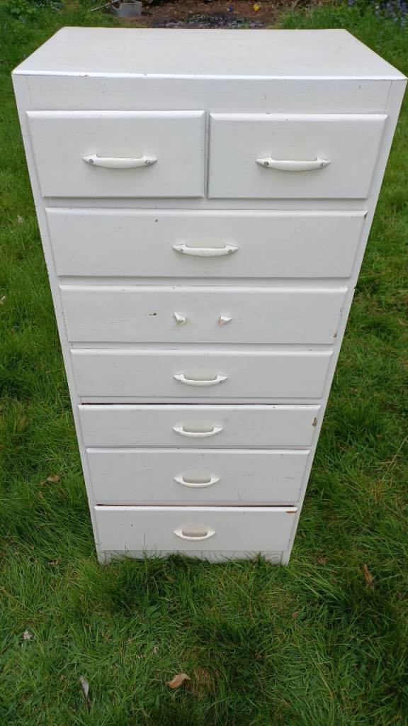 A GREAT WOODEN CABINET WITH DRAWERS 