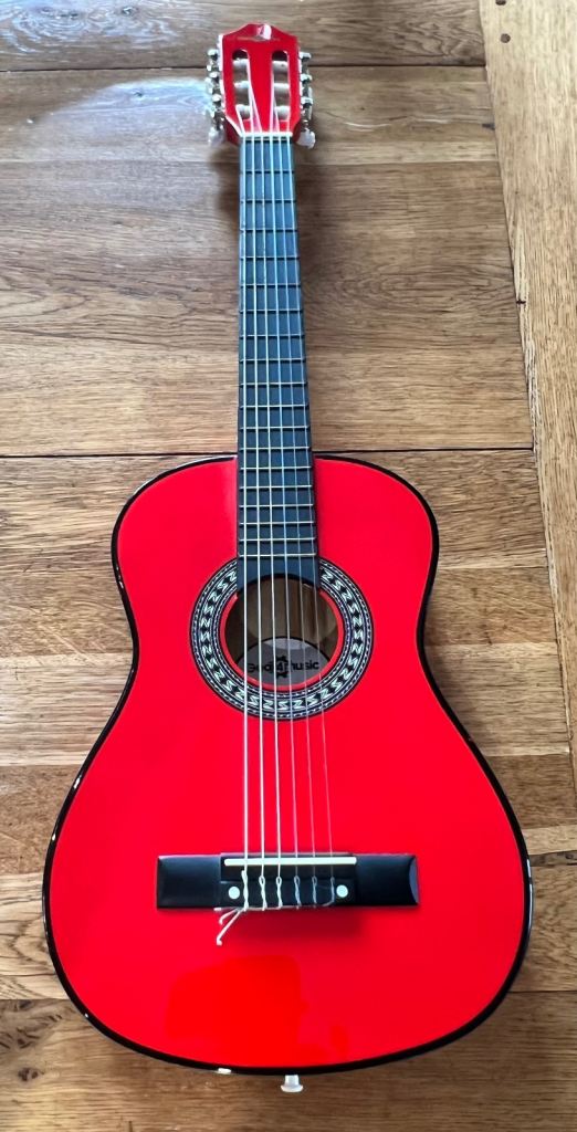 Two half sized guitars. 